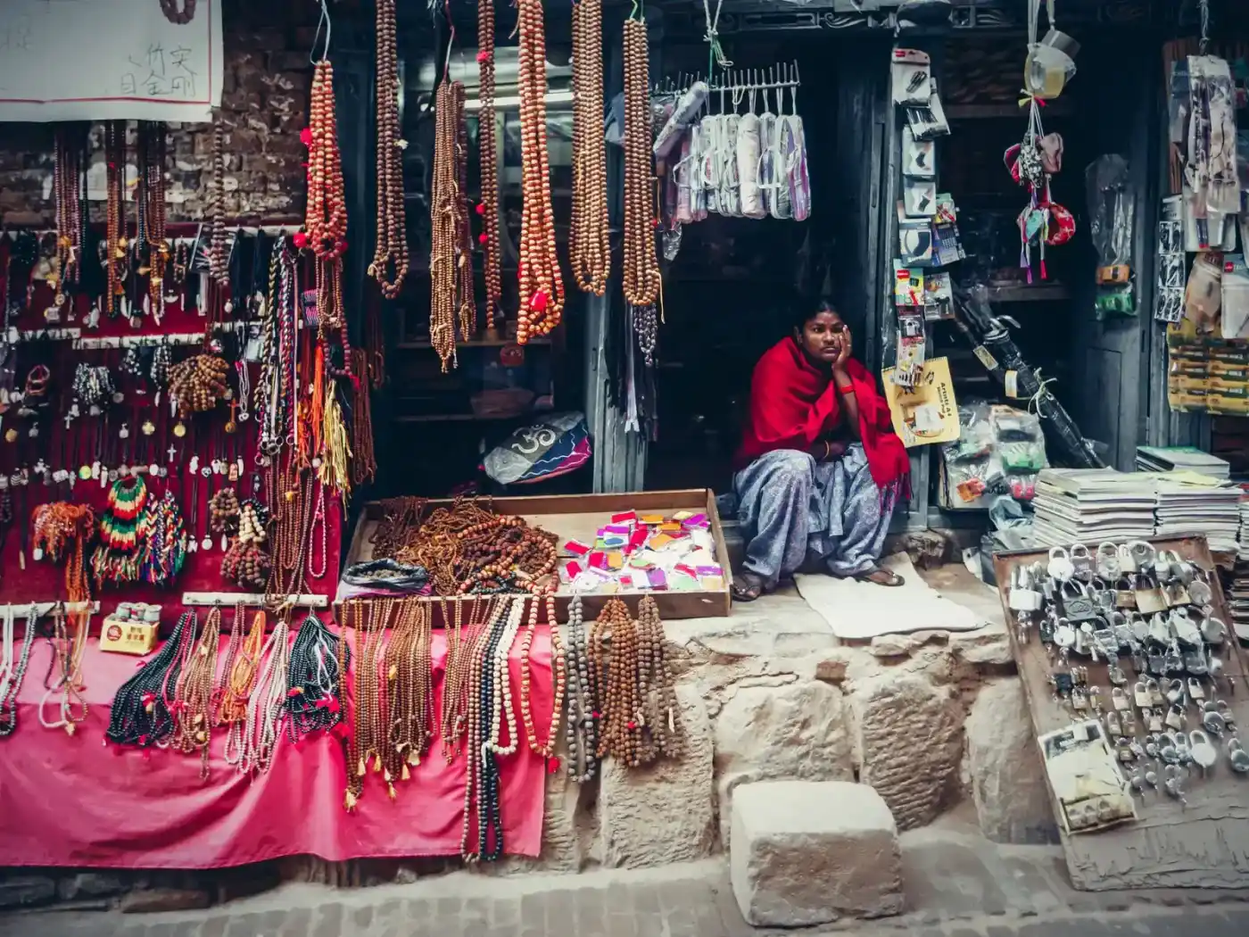 A market stall with handmade jewelry hanging on display